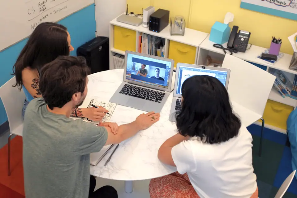 Team reviewing visual materials during a pre-event briefing session.
