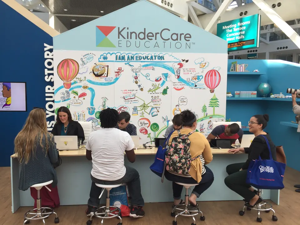 A conference booth with an ImageThink mural