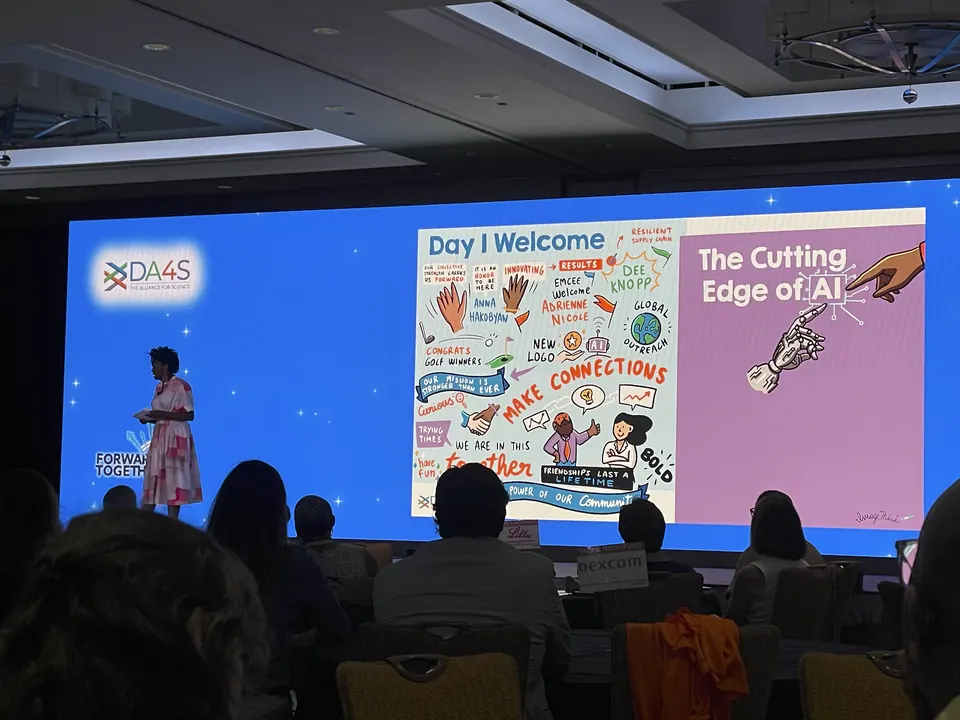 Attendees viewing a graphic recording at a life sciences meeting