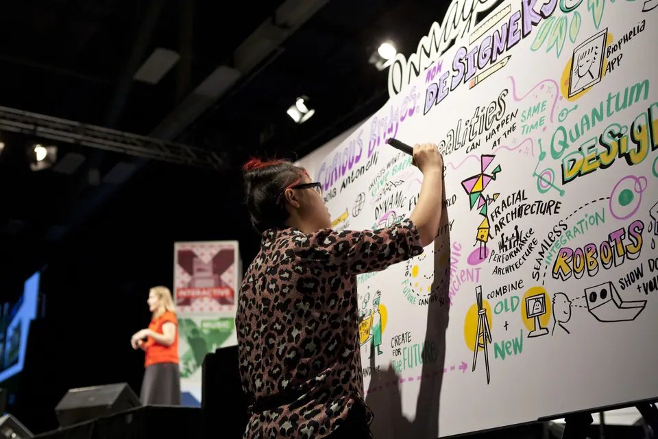 An ImageThink artist drawing a SXSW keynote on stage